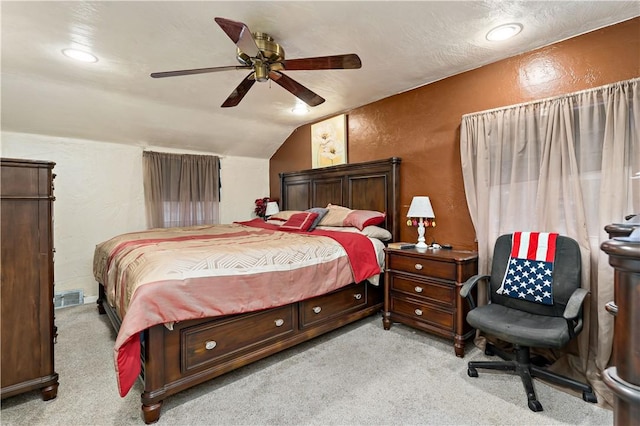 bedroom featuring lofted ceiling, light carpet, and ceiling fan