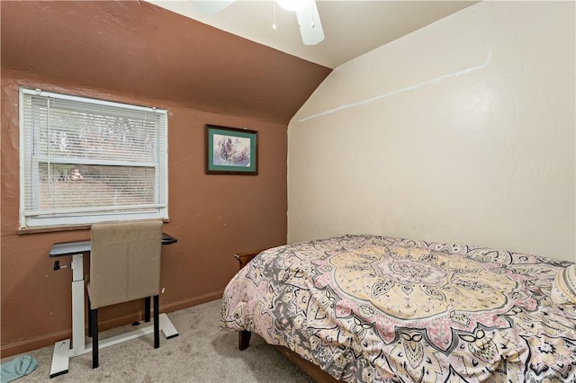 carpeted bedroom with lofted ceiling and ceiling fan