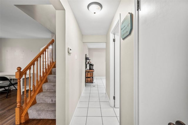 hallway featuring light tile patterned floors