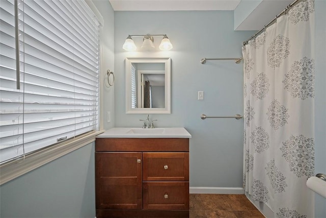 bathroom featuring vanity, tile patterned flooring, and a shower with shower curtain