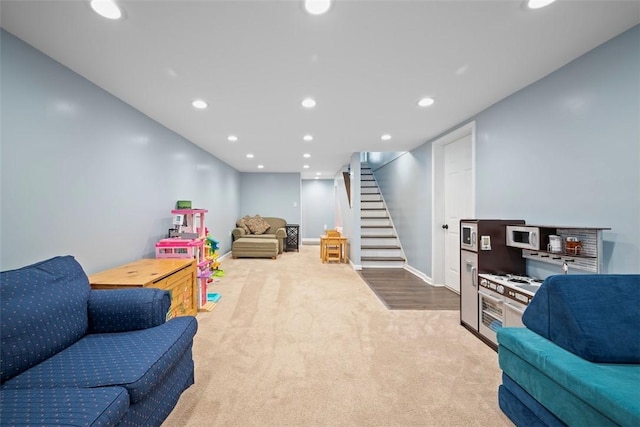 playroom featuring light colored carpet