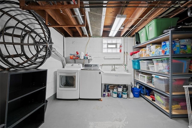 laundry area featuring sink and washer and clothes dryer