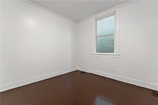 unfurnished room with crown molding and dark hardwood / wood-style flooring