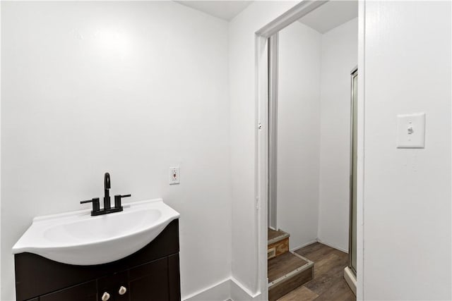 bathroom with vanity and hardwood / wood-style floors