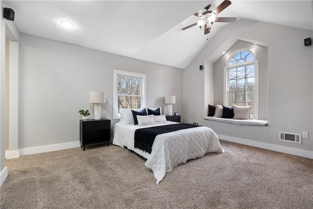 carpeted bedroom with ceiling fan and lofted ceiling