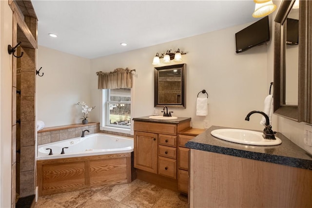 bathroom featuring vanity and a bathing tub