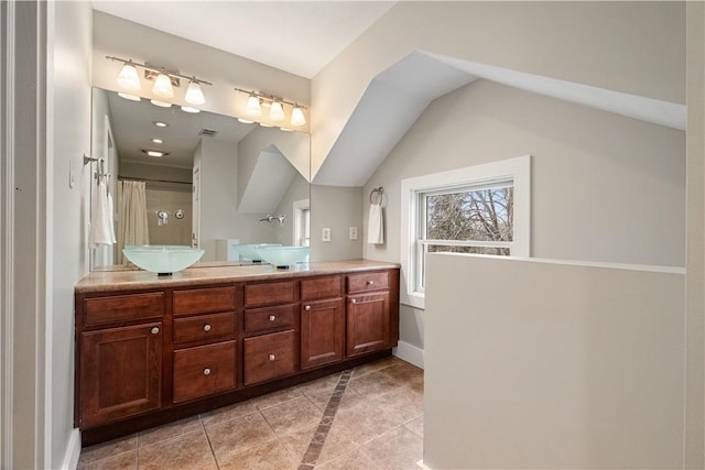 bathroom featuring tile patterned flooring and vanity