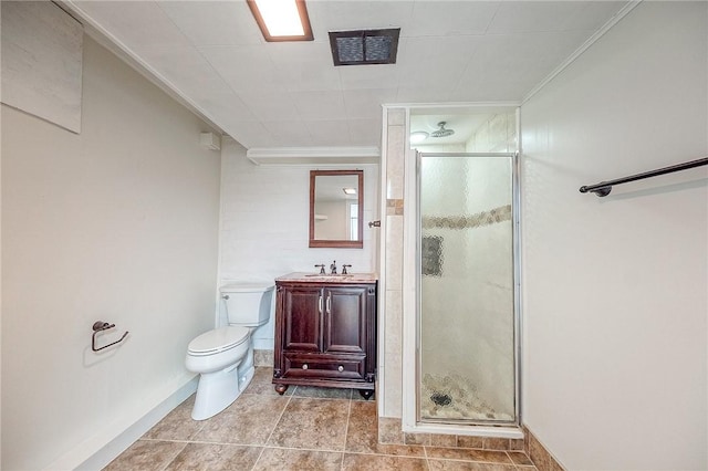 bathroom with crown molding, vanity, toilet, and a shower with door