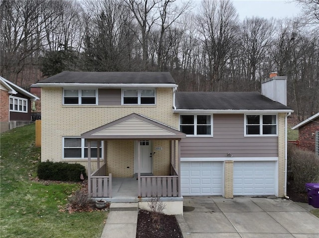 view of front of property featuring a garage and a porch