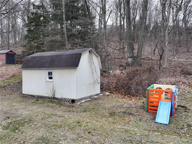 view of outbuilding featuring a yard