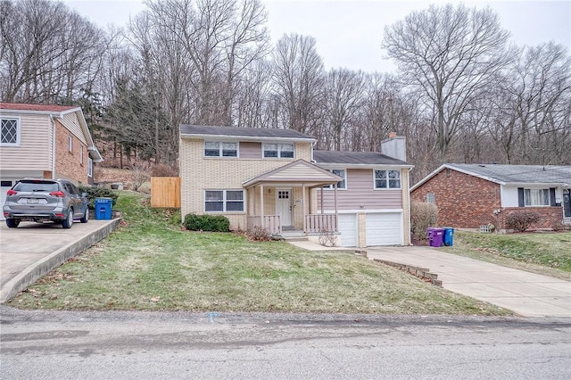 view of front of house with a garage and a front yard