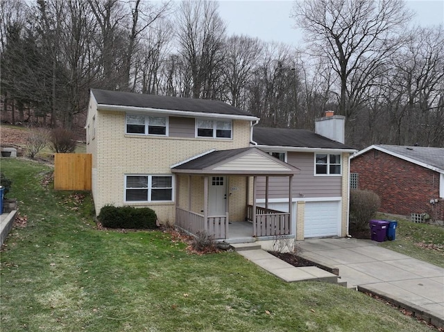 view of front property with a garage and a front yard