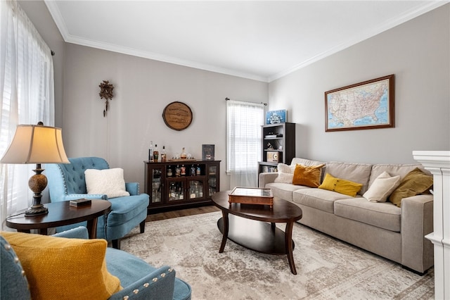 living room with light hardwood / wood-style flooring and ornamental molding