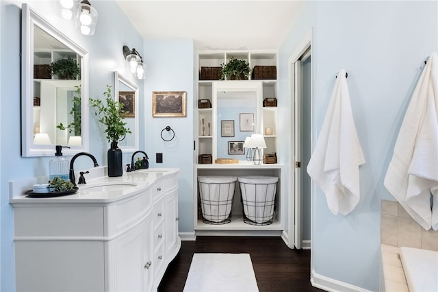 bathroom featuring vanity and hardwood / wood-style floors