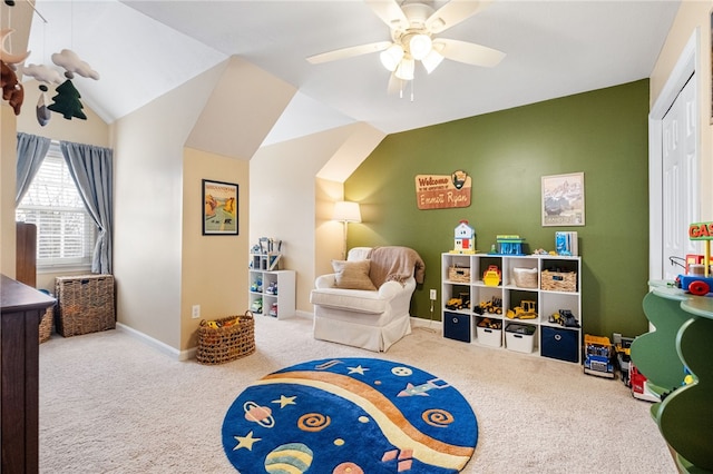 playroom featuring ceiling fan, vaulted ceiling, and carpet