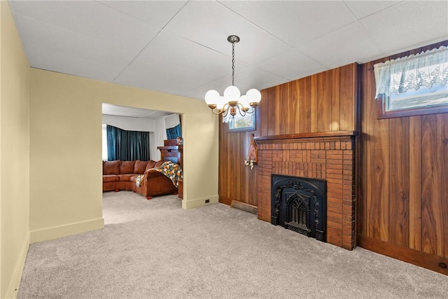 living room featuring light carpet, a notable chandelier, and wooden walls