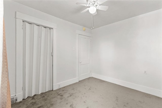 unfurnished bedroom featuring ceiling fan and light carpet