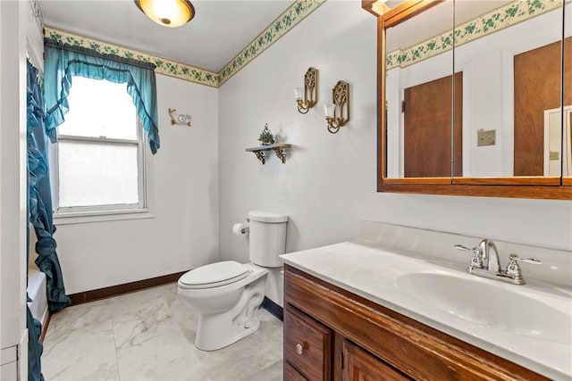 bathroom with vanity and toilet