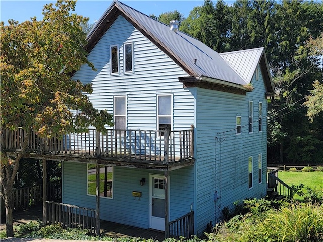 back of house with a balcony