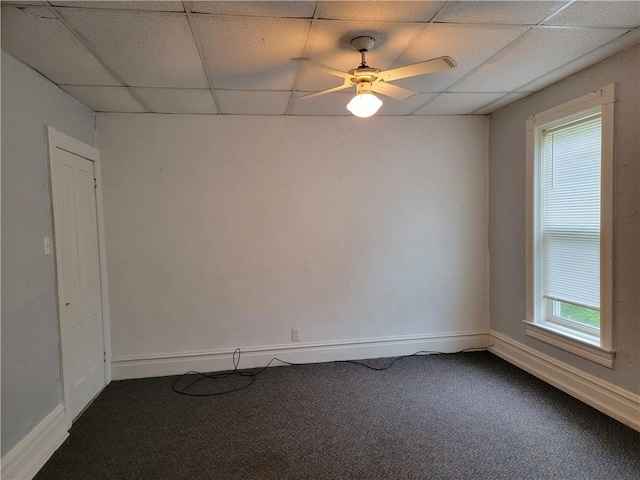 unfurnished room featuring carpet, a paneled ceiling, and ceiling fan