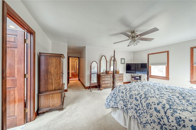 bedroom featuring light carpet and ceiling fan