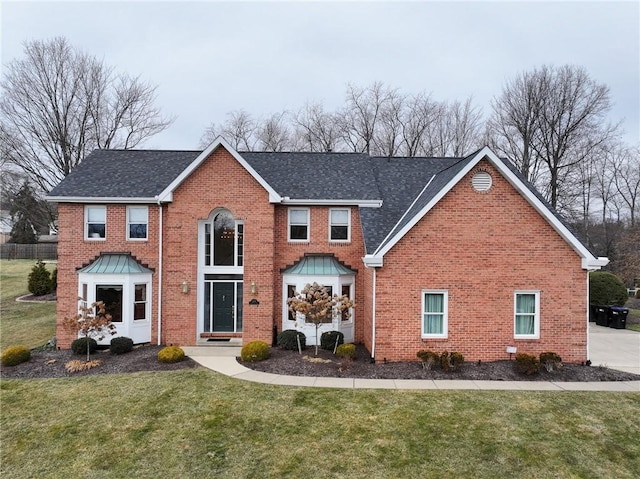 view of property with a front lawn