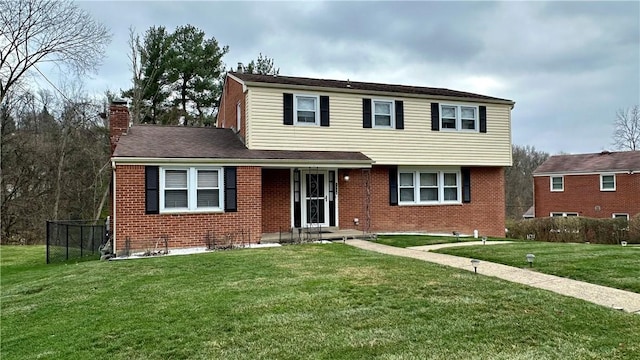 front facade featuring a front yard