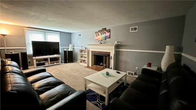 carpeted living room featuring a fireplace