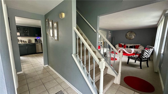 staircase featuring tile patterned floors