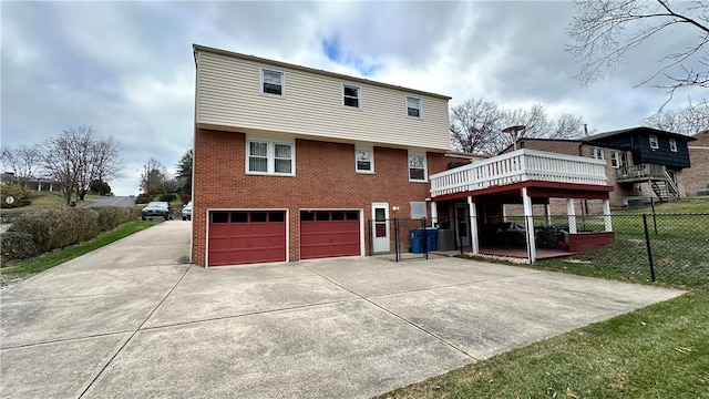 back of property with a garage