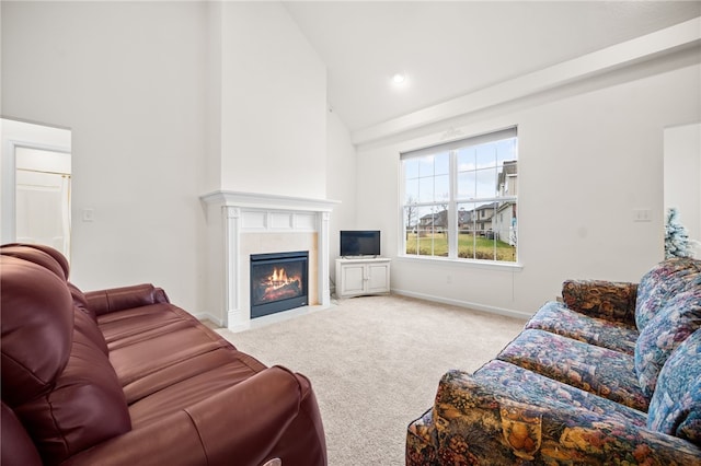 living room with a tiled fireplace, high vaulted ceiling, and light carpet