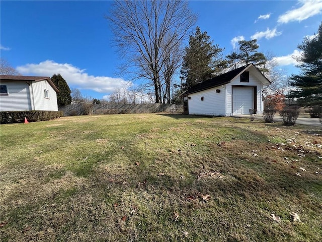 view of yard with a garage and an outdoor structure