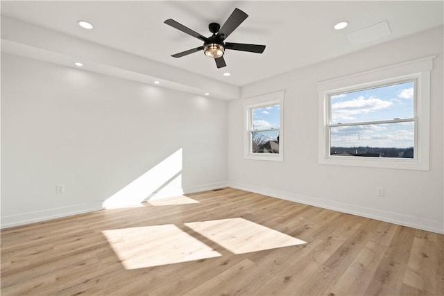 spare room with ceiling fan and light hardwood / wood-style floors