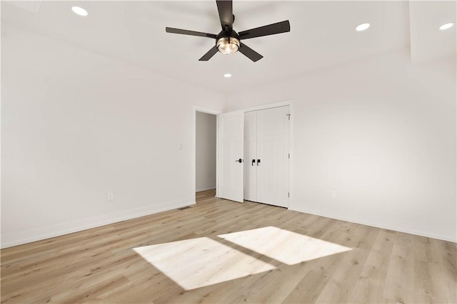 spare room featuring ceiling fan and light wood-type flooring