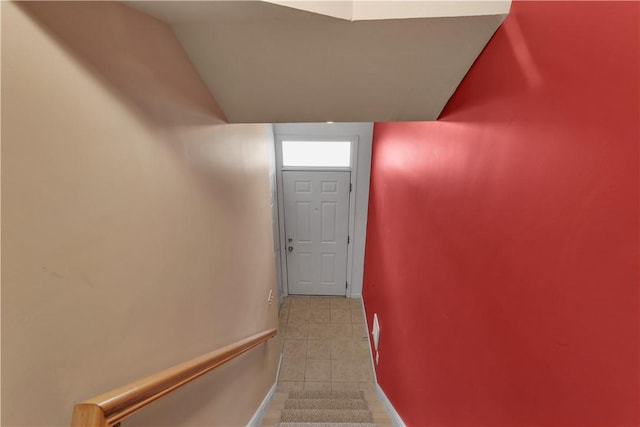 stairs with tile patterned floors