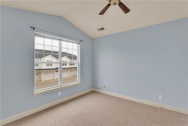 carpeted empty room featuring lofted ceiling and ceiling fan