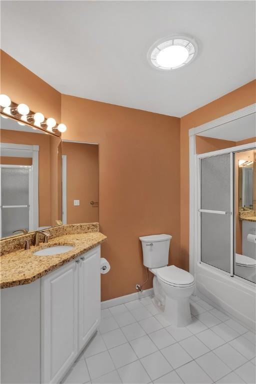 full bathroom featuring tile patterned flooring, vanity, shower / bath combination with glass door, and toilet