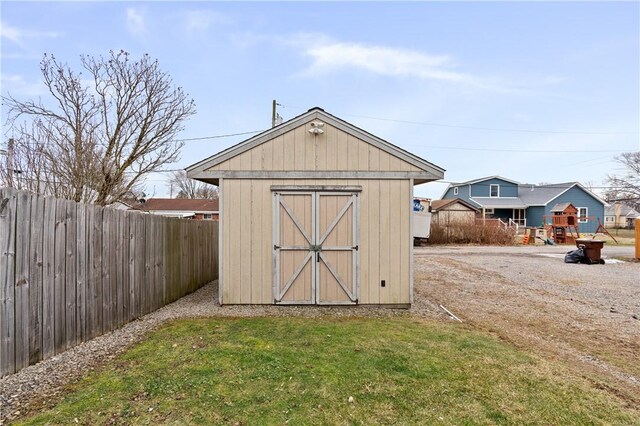 view of outdoor structure with a lawn