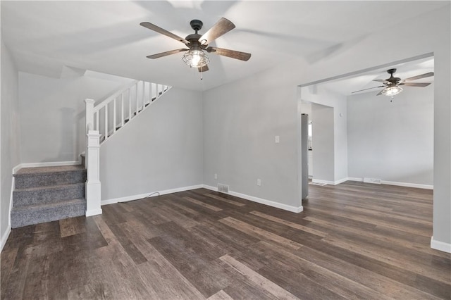 unfurnished living room featuring dark hardwood / wood-style floors and ceiling fan