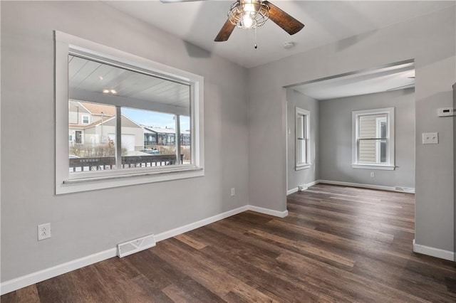 unfurnished room featuring dark hardwood / wood-style flooring and ceiling fan