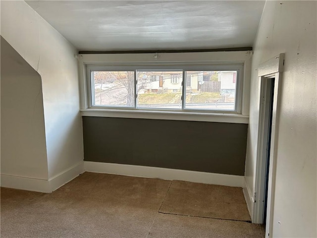 interior space with a wealth of natural light and light colored carpet