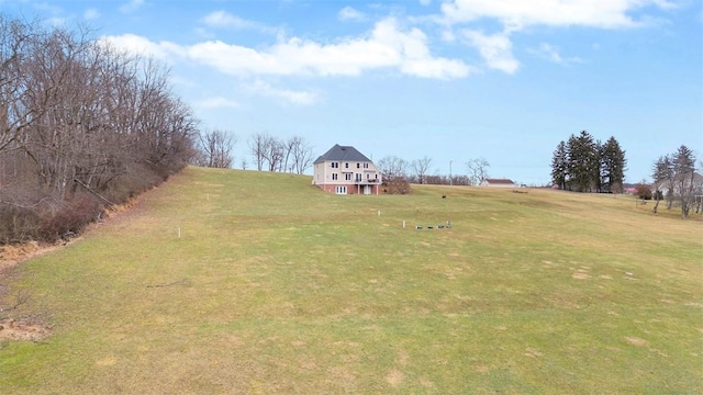 view of yard with a rural view