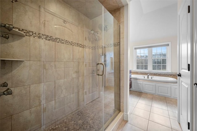 bathroom featuring shower with separate bathtub and tile patterned flooring