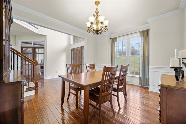 dining space with crown molding and dark hardwood / wood-style floors