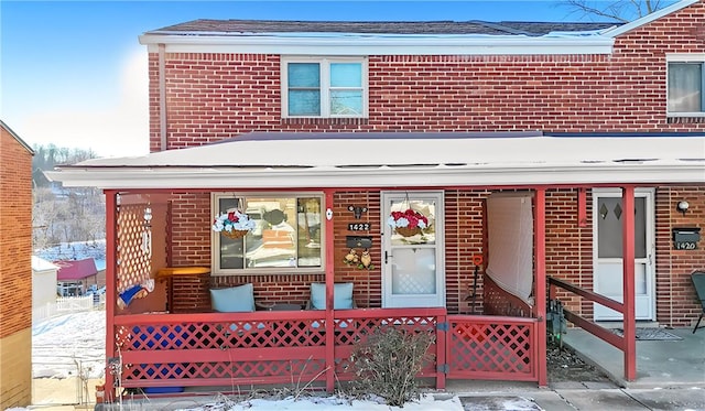 view of front of home featuring brick siding