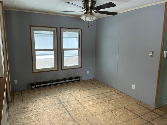 unfurnished room featuring a healthy amount of sunlight, a baseboard heating unit, ceiling fan, and ornamental molding