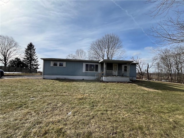 view of front of home with a front yard and covered porch