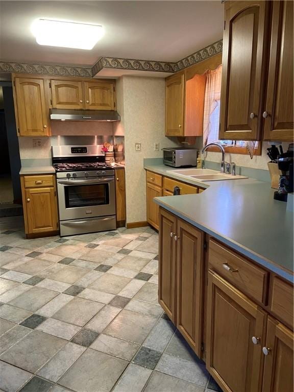 kitchen with sink and stainless steel range with gas stovetop