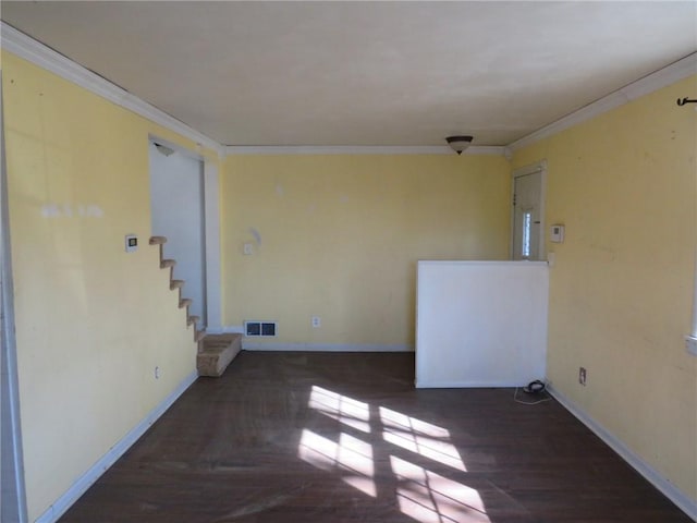 unfurnished room featuring crown molding and dark hardwood / wood-style floors