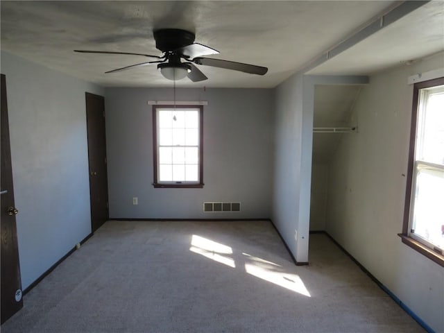 unfurnished bedroom with visible vents, baseboards, carpet, a closet, and a ceiling fan